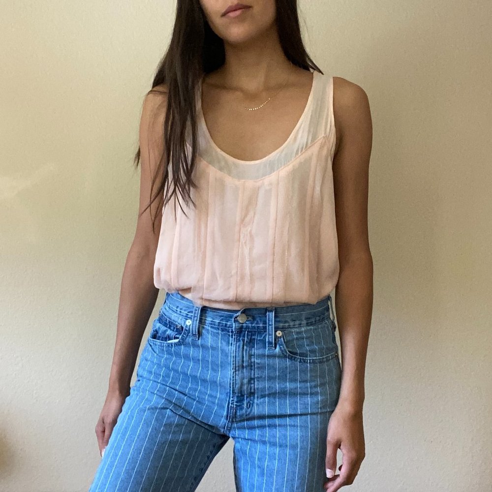 Light pink sleeveless blouse